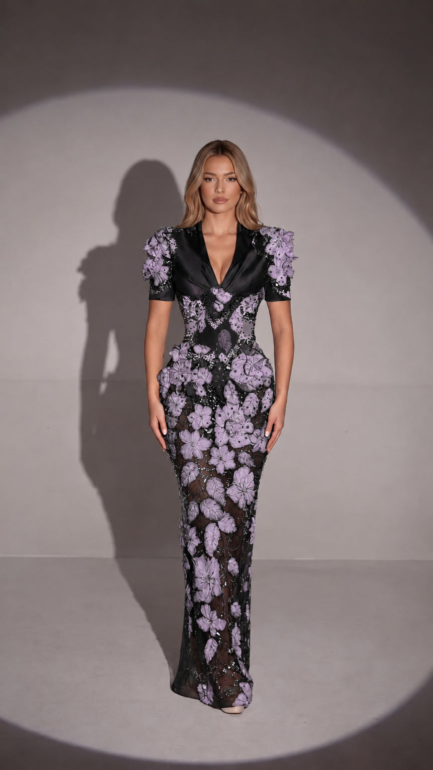 Front view of black 3D floral appliqué embellished formal gown