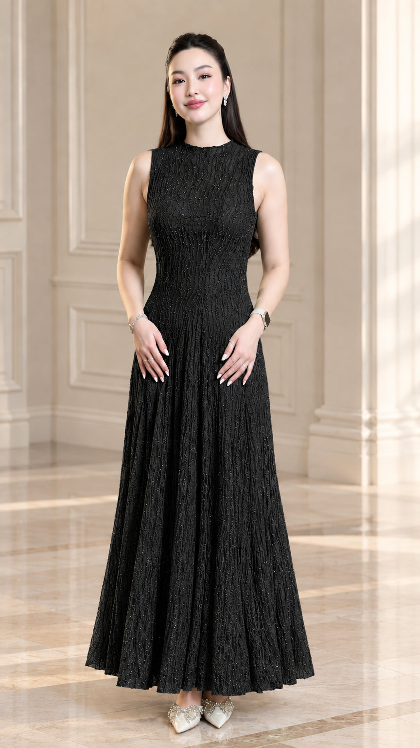 Front view of model wearing black sleeveless textured plissé maxi dress