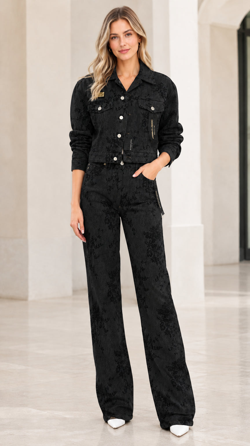 Model wearing black floral embossed denim cropped jacket and matching wide-leg trousers