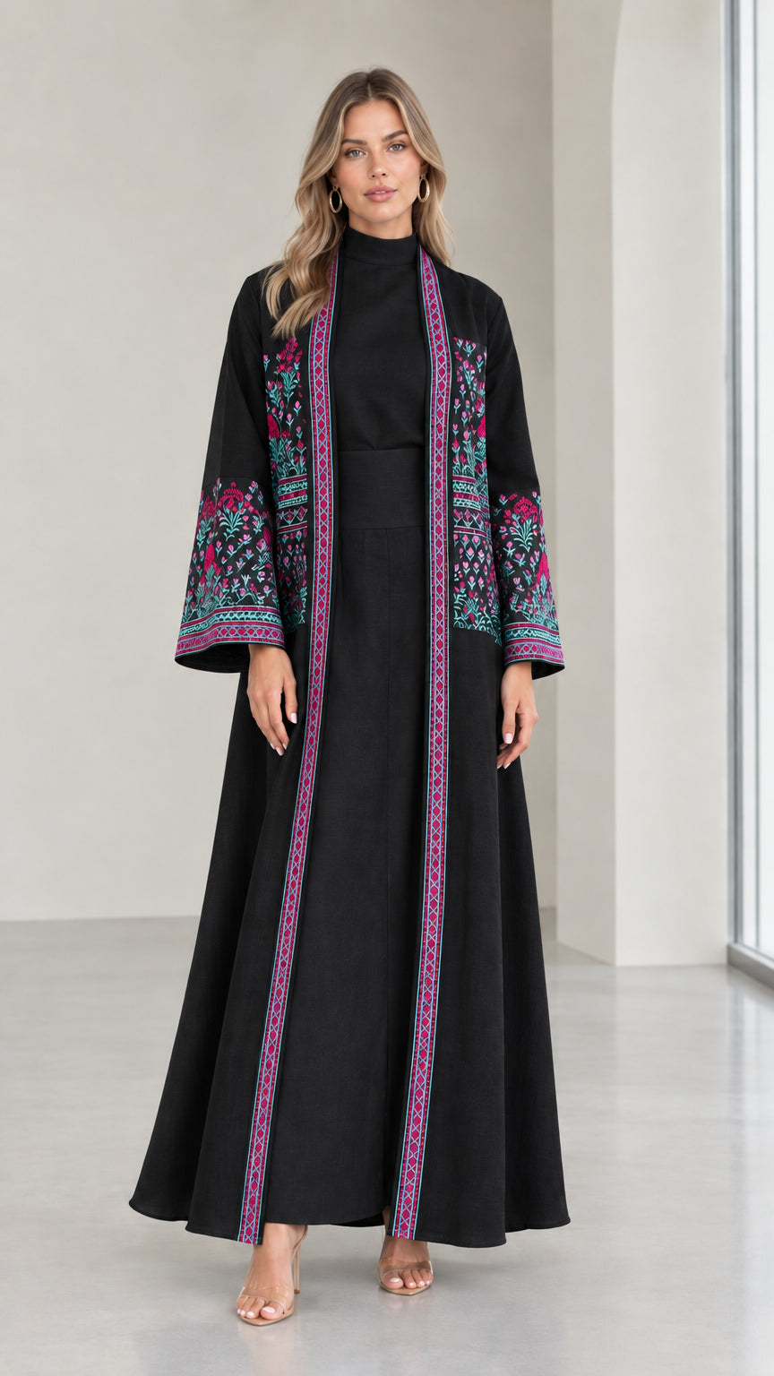 Front view of woman wearing Black embroidered two-piece abaya set