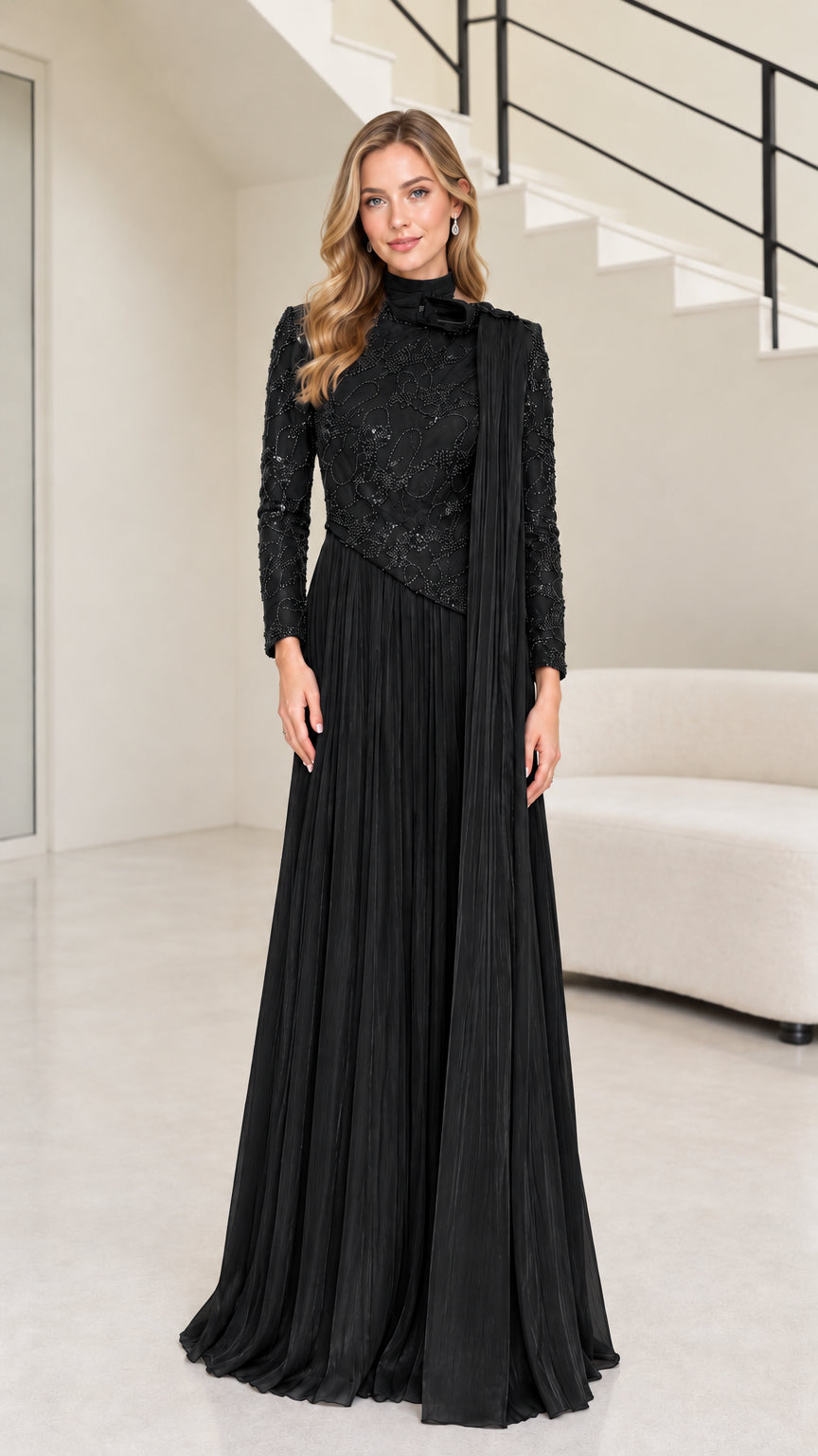 Front full-length view of black long sleeve beaded mock neck pleated maxi evening gown