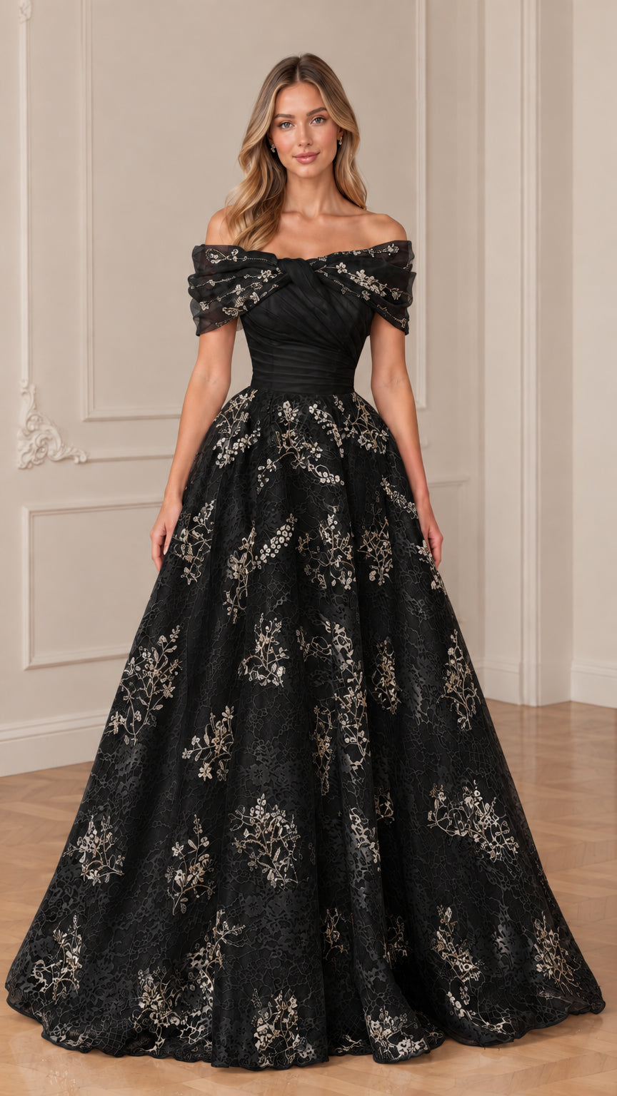 Front view of model in black and gold embroidered off-the-shoulder formal gown