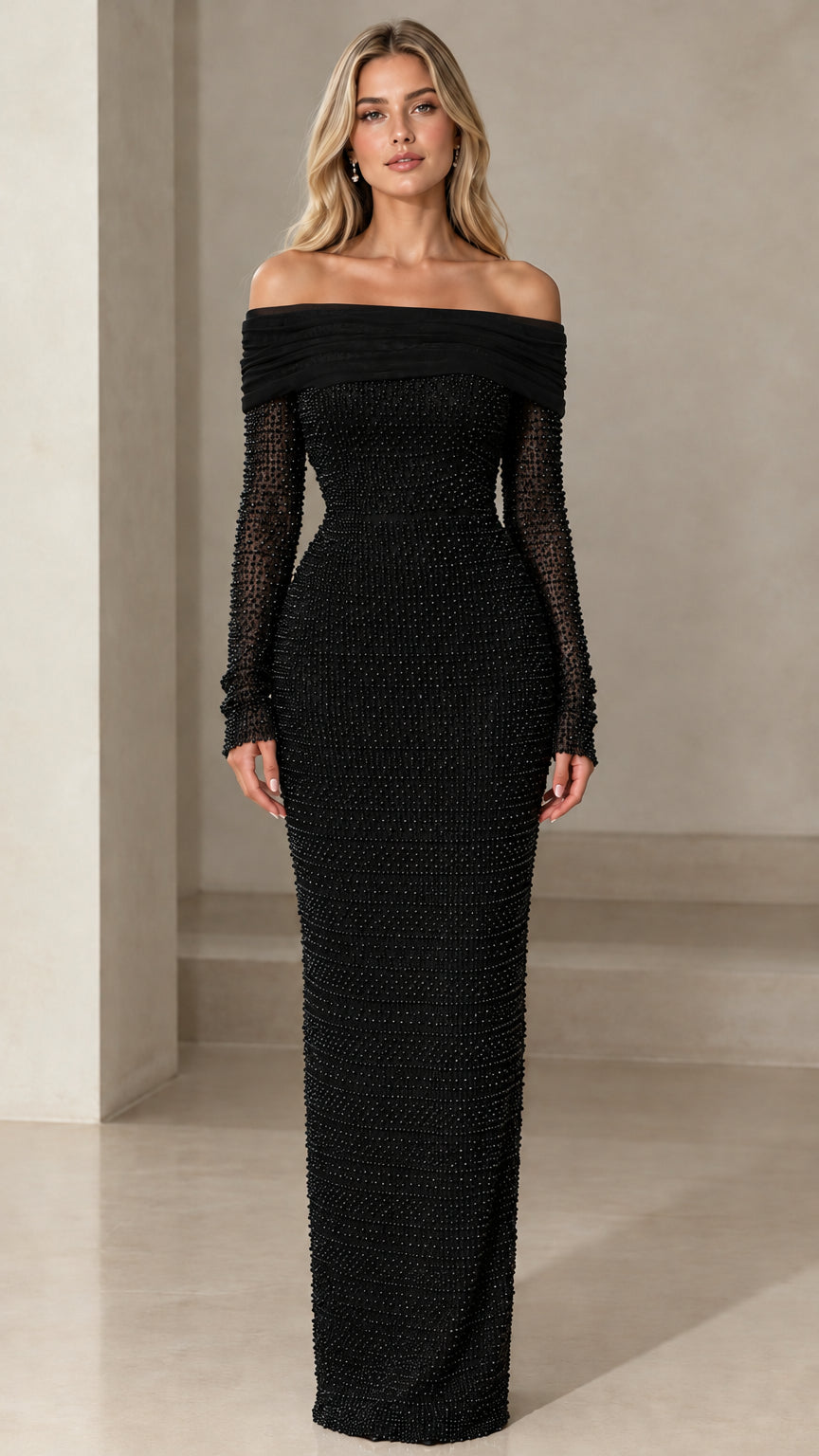 Model wearing black off-the-shoulder pearl embellished long sleeve column maxi dress