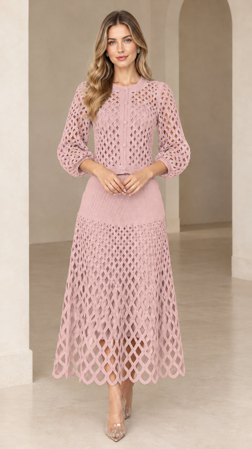 Model wearing blush pink openwork crochet knit two-piece midi dress set