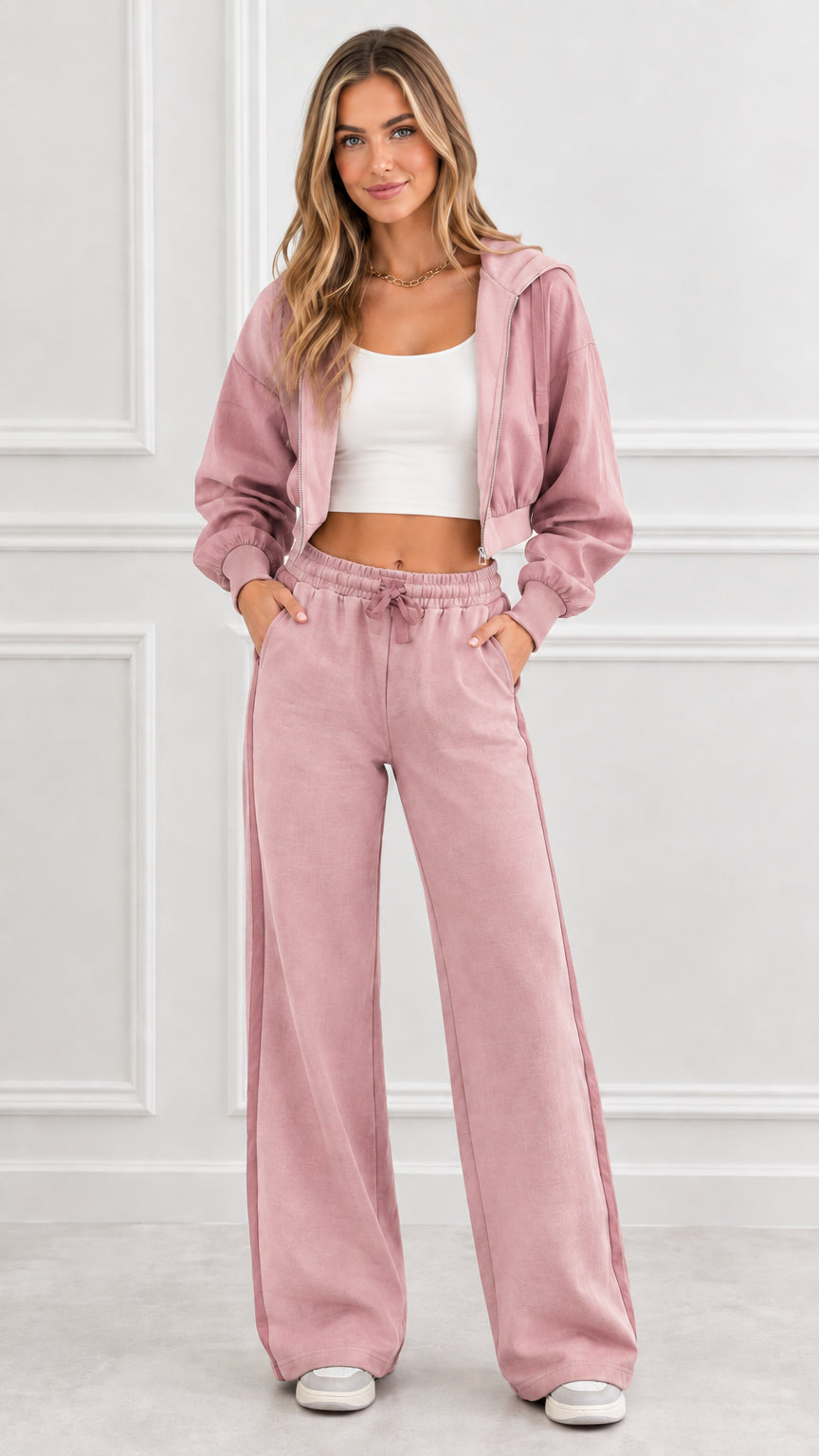 Front view of woman wearing dusty pink cropped zip hoodie and matching wide leg sweatpants