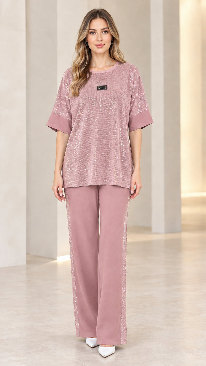Full-length view of model wearing dusty rose shimmer knit top and wide leg pant set