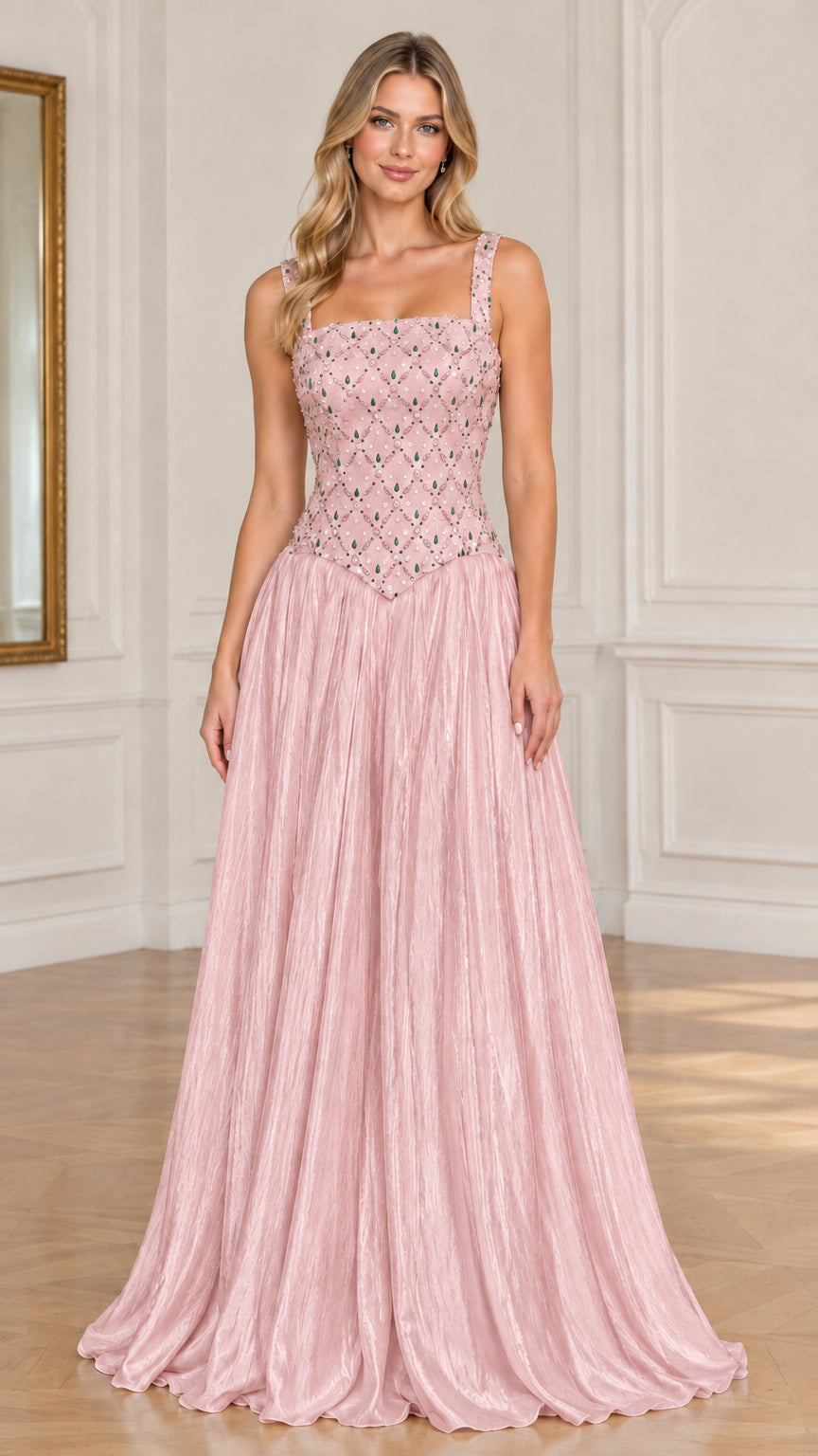 Model wearing blush pink embellished pleated maxi evening dress