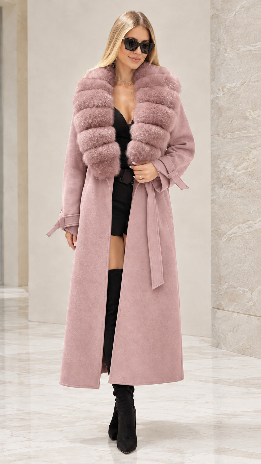 Front full view of woman wearing dusty pink longline trench coat with faux fur collar