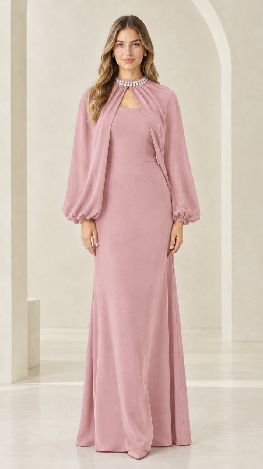 Front view of woman wearing dusty pink rhinestone neckline cape evening dress