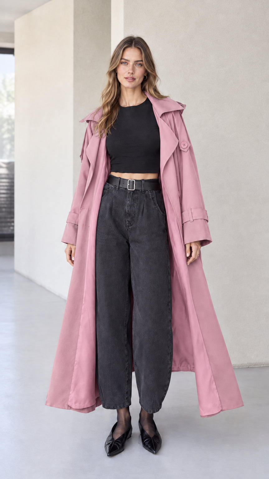 Full front view of dusty pink hooded maxi trench coat on model with dark denim