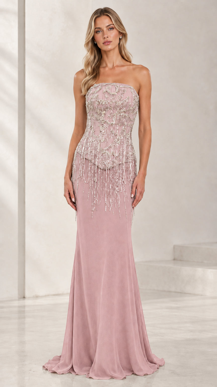 Model wearing dusty rose strapless beaded fringe formal maxi dress