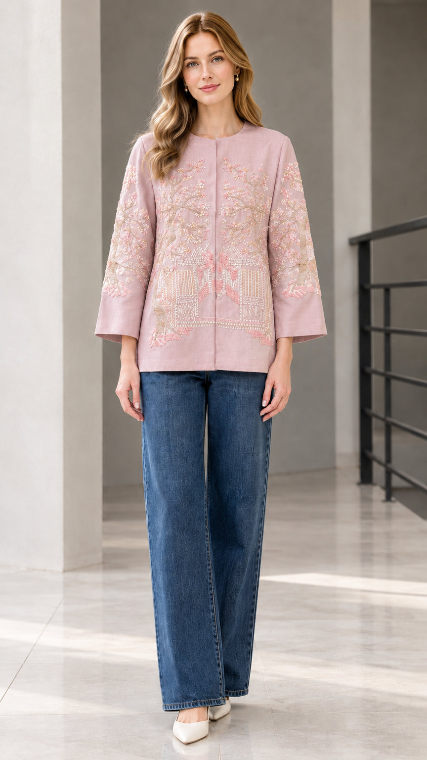 Dusty pink floral embroidered collarless jacket modeled with blue jeans