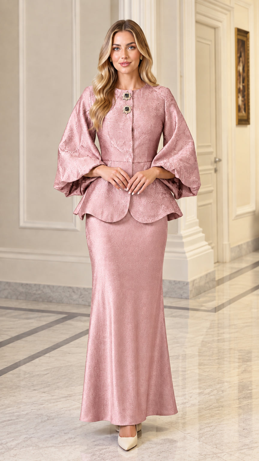Model wearing dusty pink jacquard peplum jacket and long skirt set