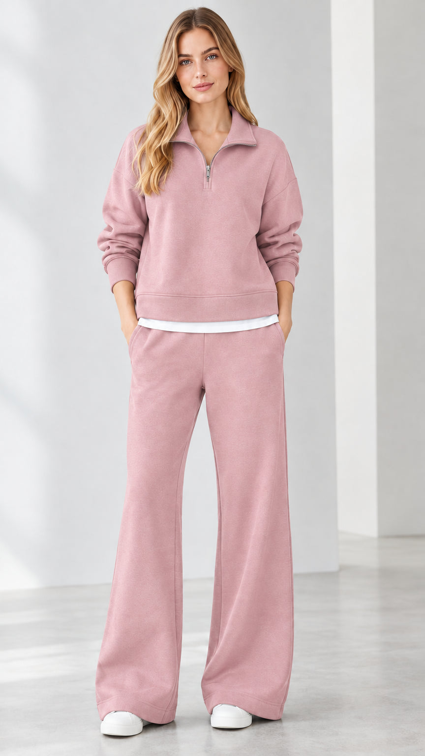 Front view of model wearing dusty pink quarter-zip sweatshirt and wide-leg pants set