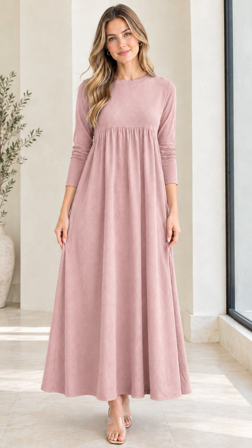 Front view of model wearing dusty pink long sleeve empire waist maxi dress