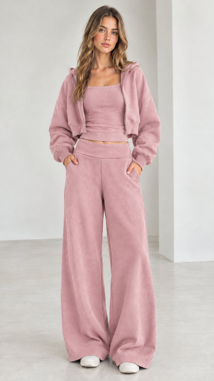 Full front view of model wearing the dusty pink 3-piece cropped hoodie and sweatpants set