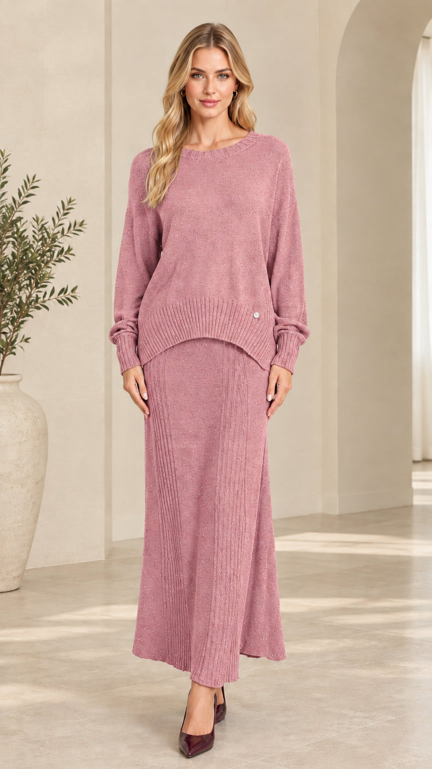 Front view of women's shimmer ribbed knit sweater and maxi skirt set in dusty pink