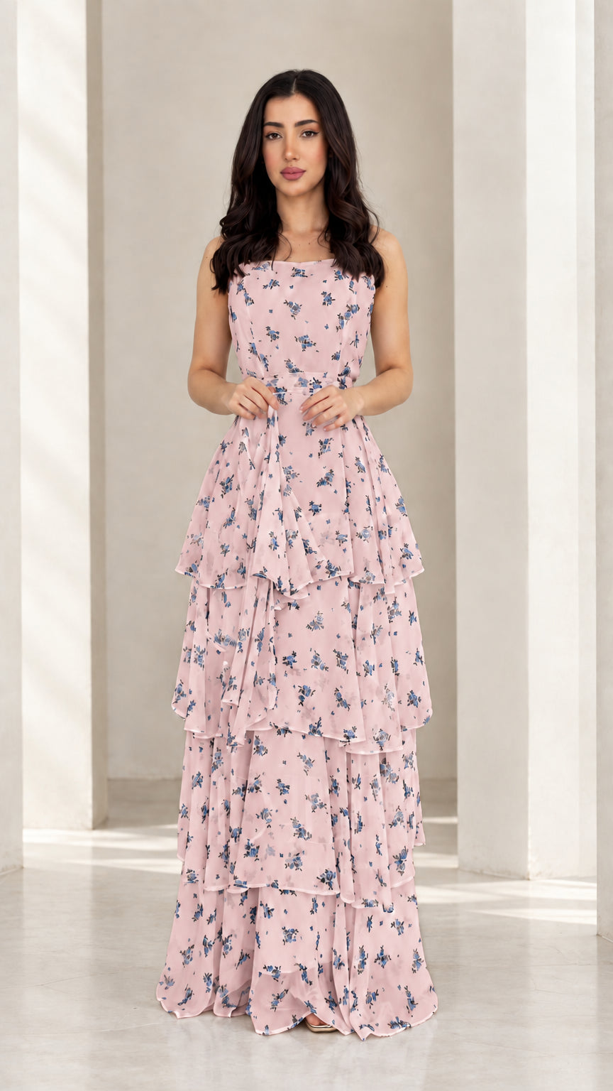 Model wearing soft pink floral tiered ruffle maxi dress