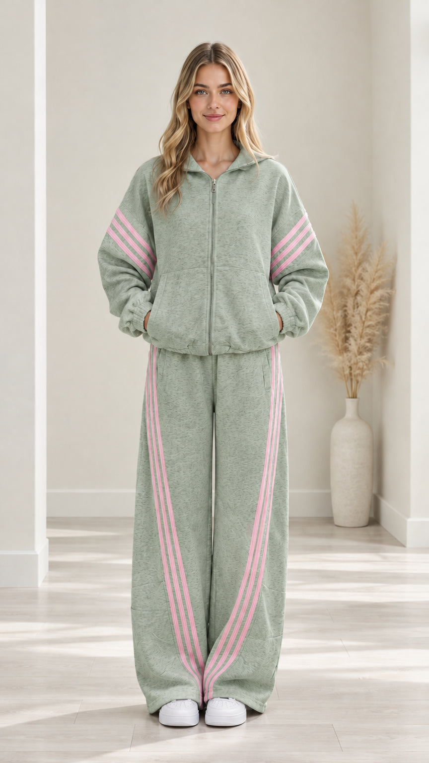 Woman modeling Sage Green two-piece casual tracksuit set with pink side stripes