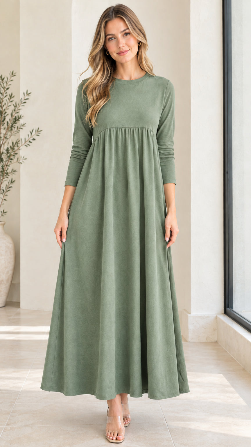 Front view of model wearing sage green long sleeve empire waist maxi dress