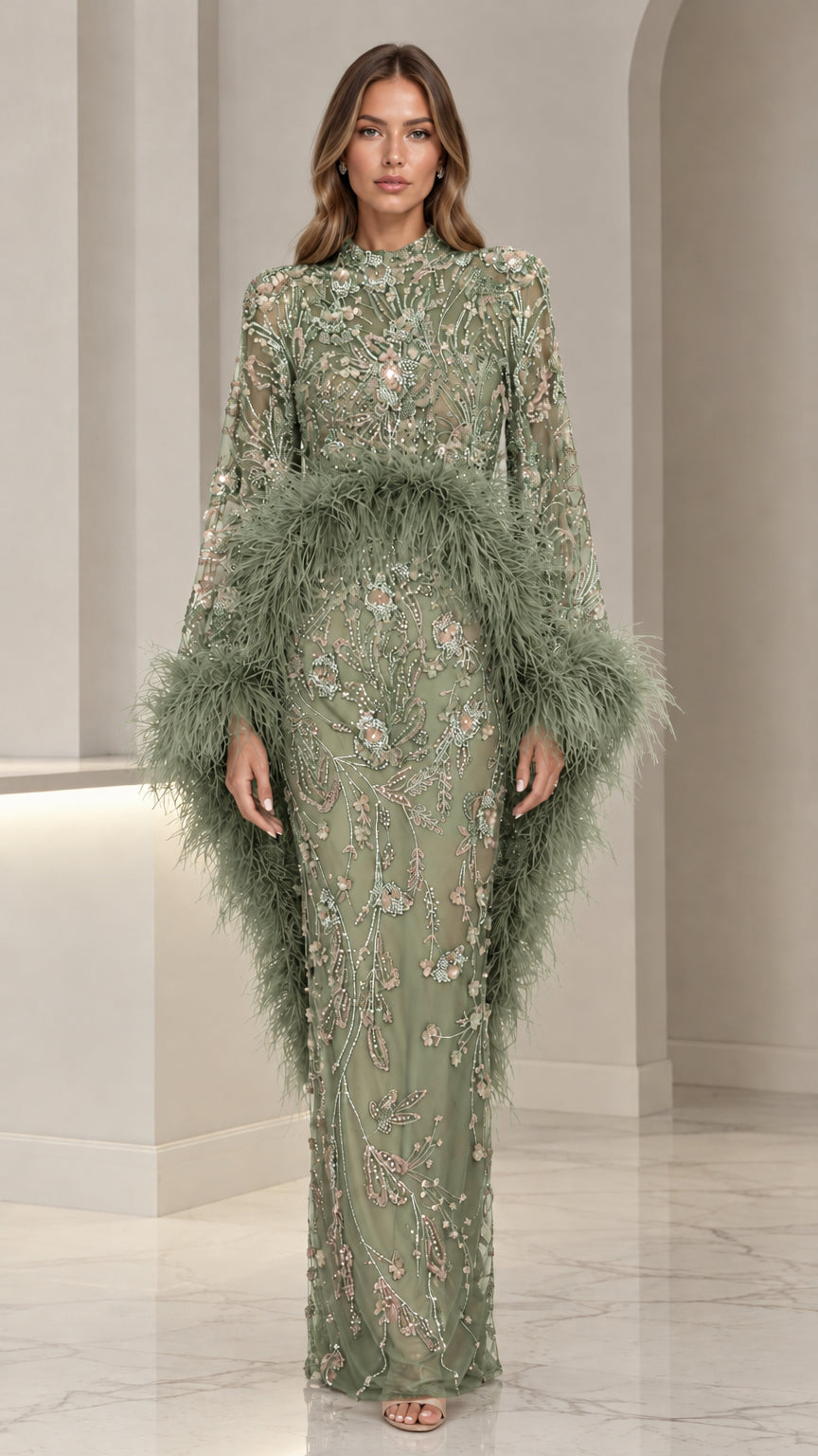 Woman wearing sage green floral beaded maxi gown with feather accents