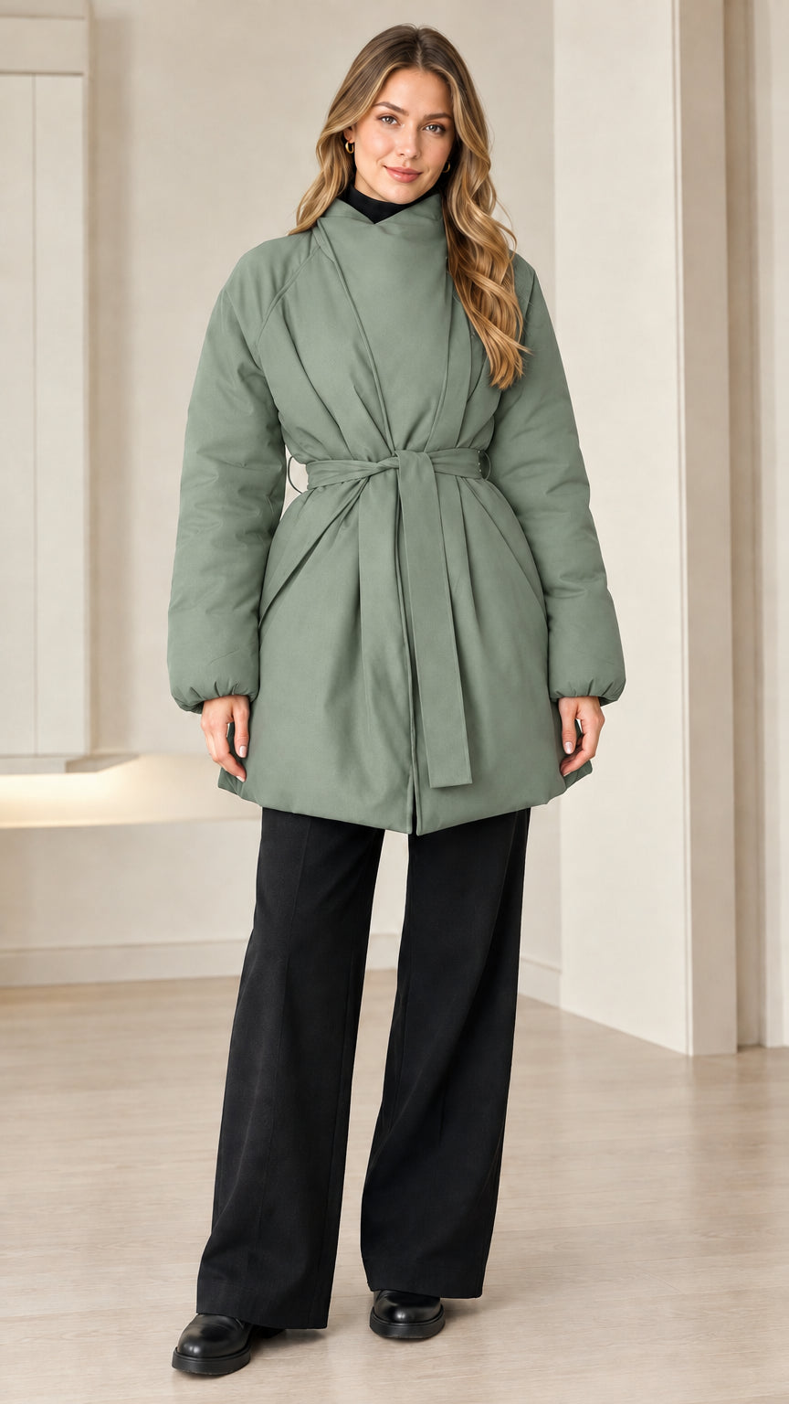 Model wearing sage green belted padded jacket with high wrap collar