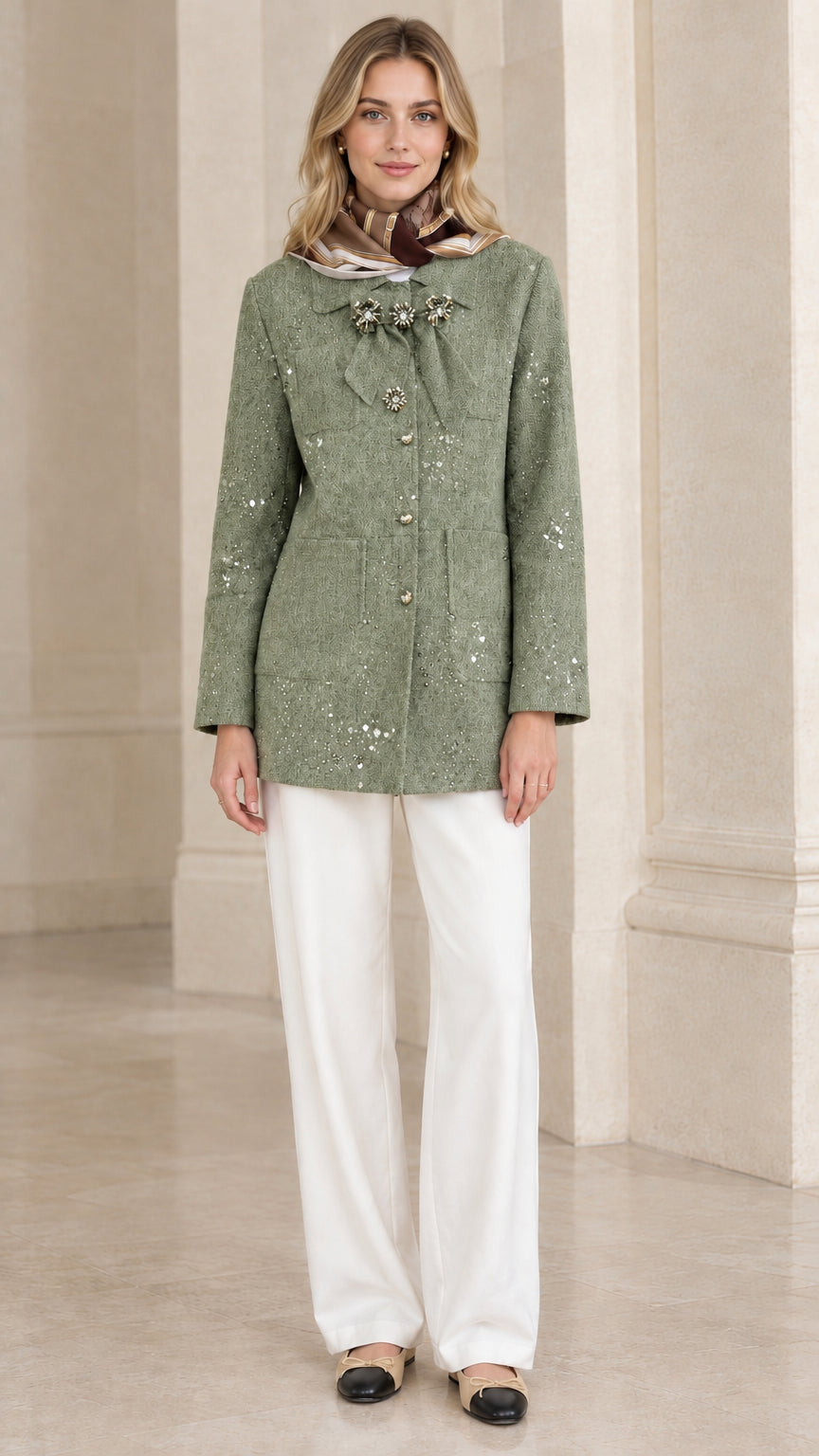 Full front view of model wearing sage green sequin embellished tweed jacket