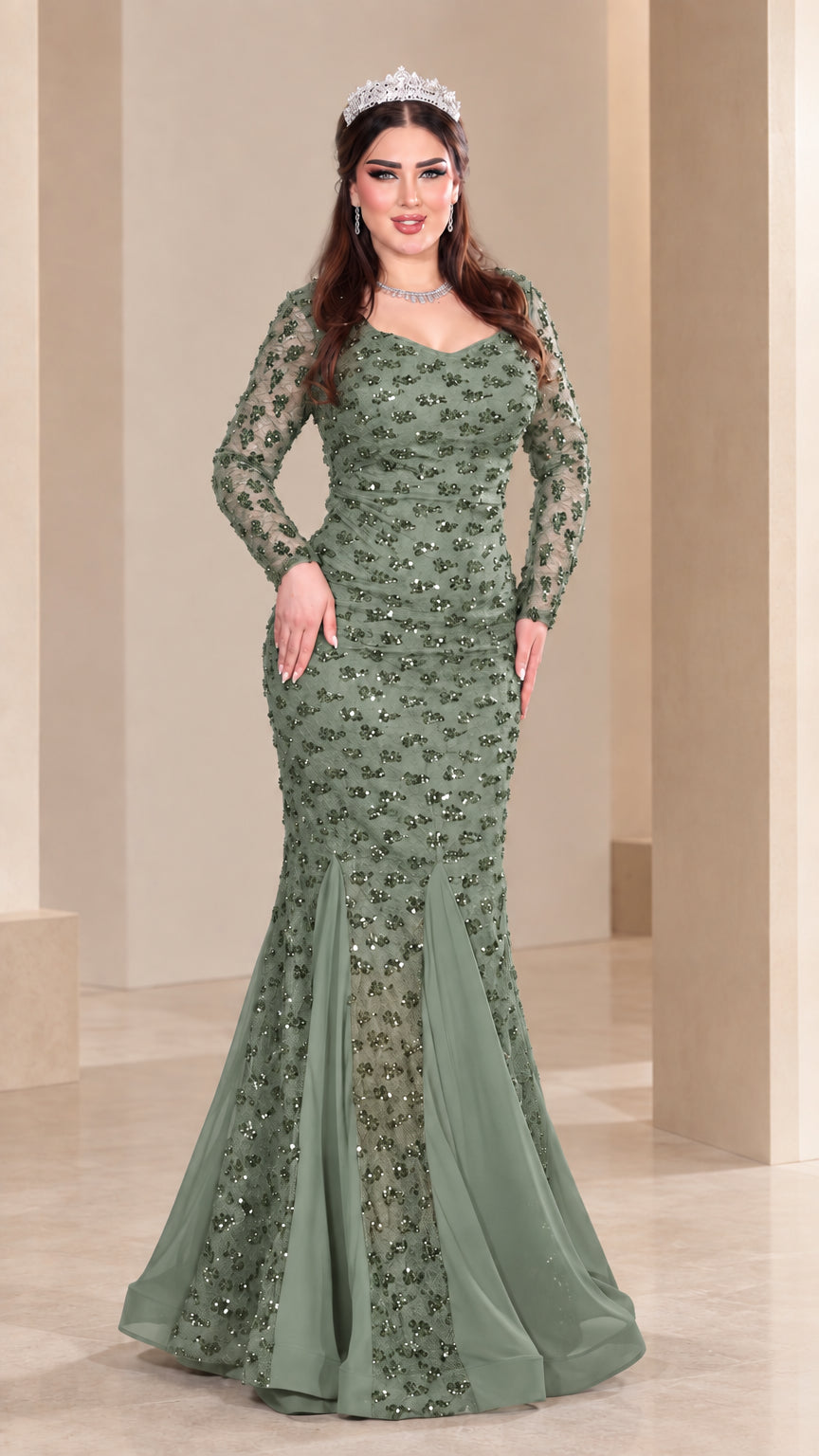 Front view of model wearing sage green sequin long sleeve mermaid evening gown