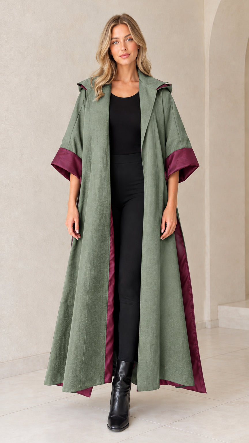 Front view of sage green hooded maxi duster coat with wine cuffs