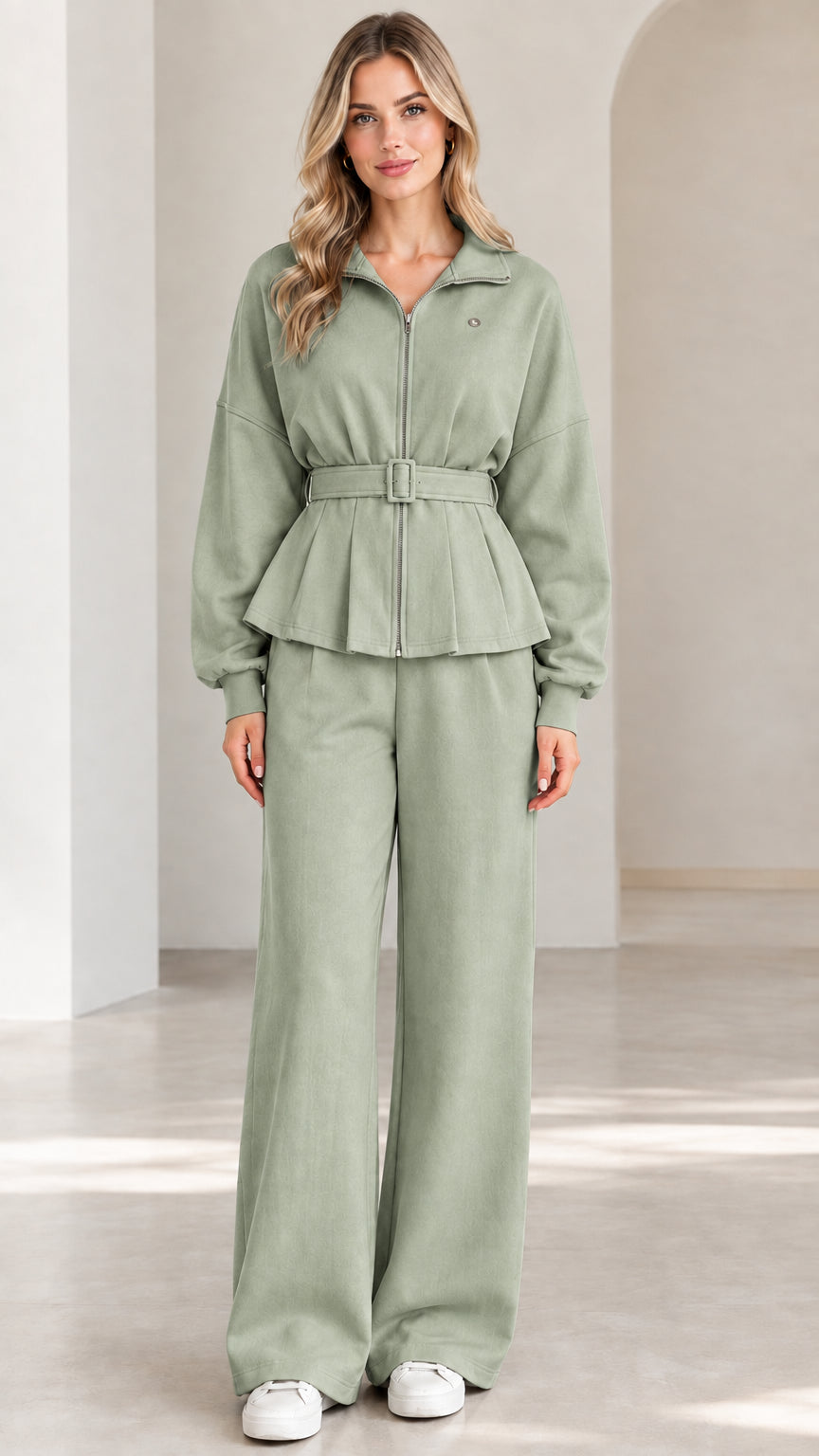 Front full-length view of sage green zip-up belted peplum jacket and wide-leg pants set