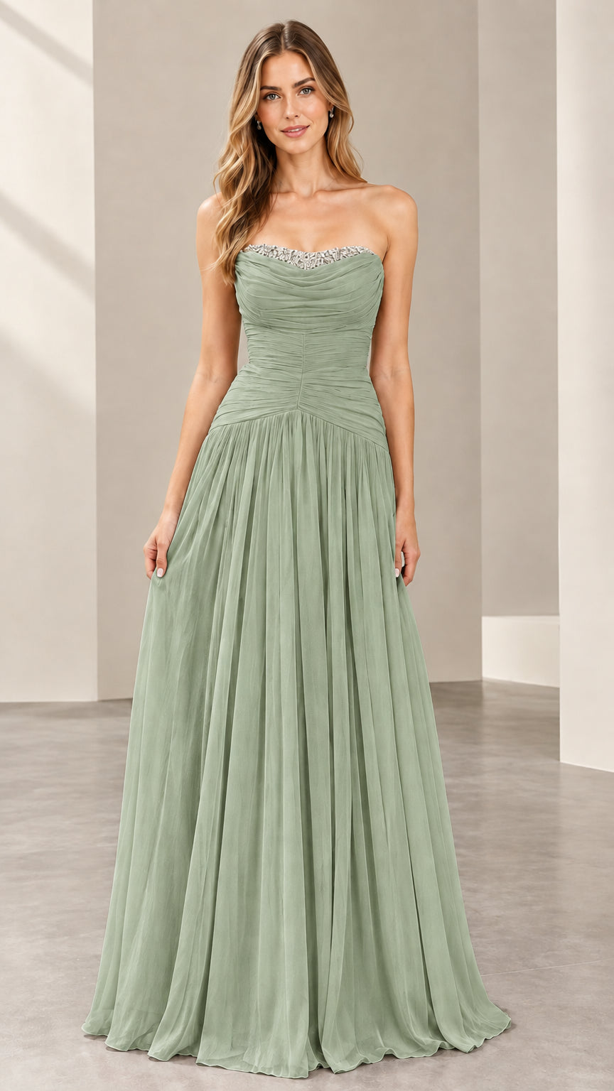 Front view of woman wearing the strapless ruched evening gown in sage green