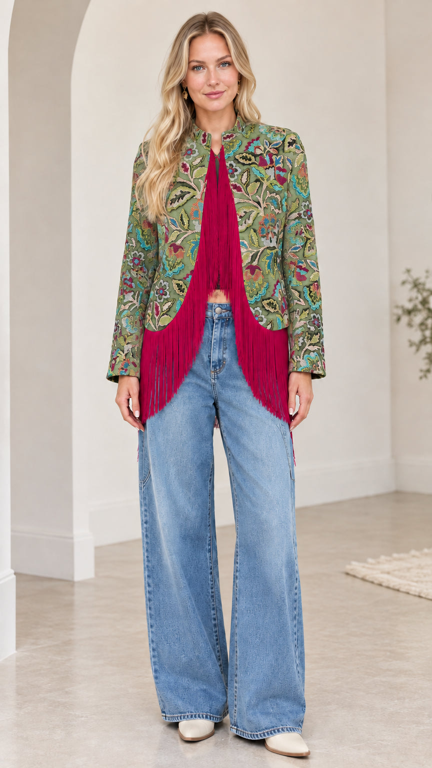 Model wearing sage green and floral jacquard jacket with vibrant magenta fringe trim