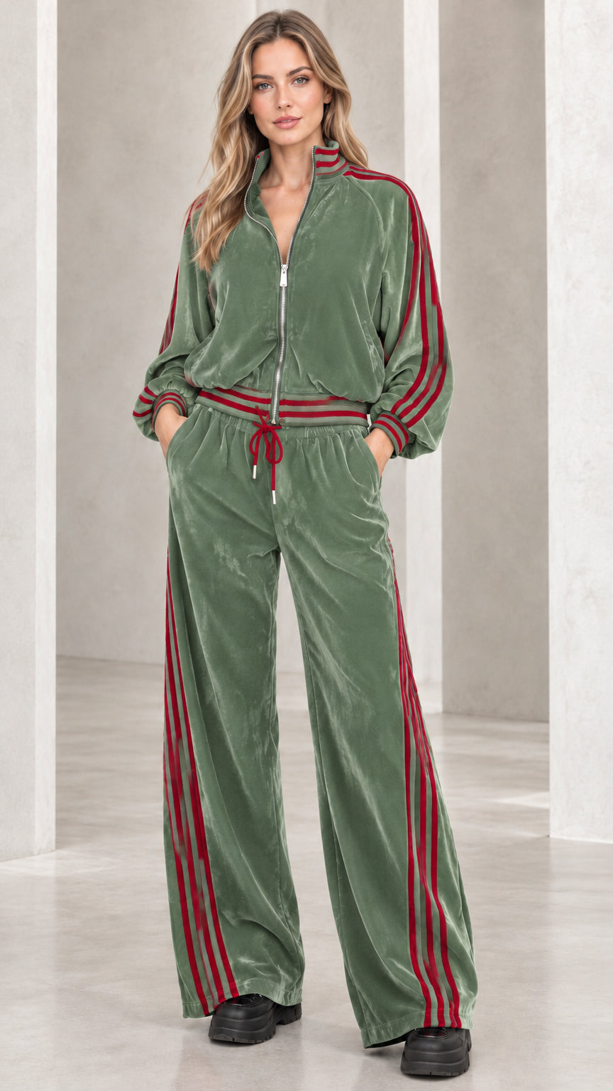 Full front view of model wearing sage green velvet tracksuit set with contrast stripes