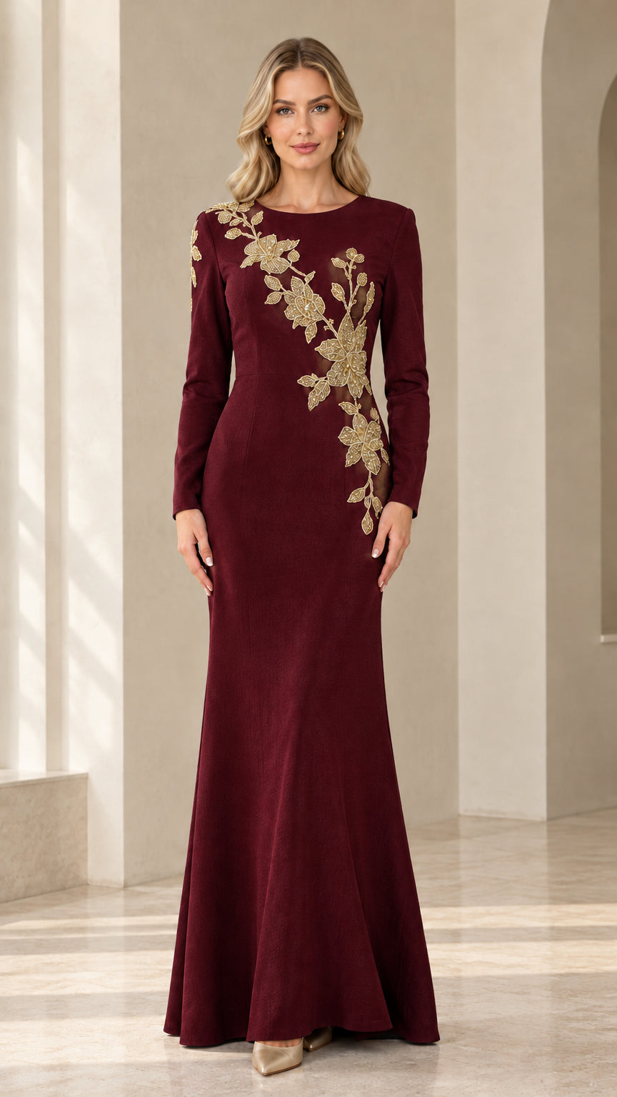 Model wearing burgundy wine long sleeve evening gown with gold embroidery