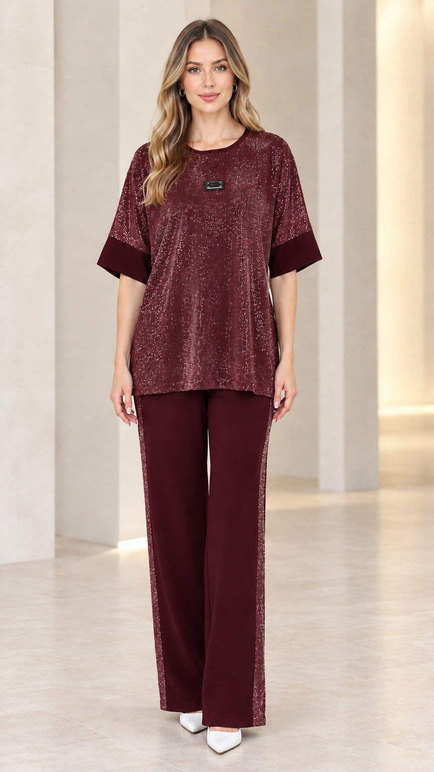 Full-length view of model wearing burgundy wine shimmer knit matching pant set