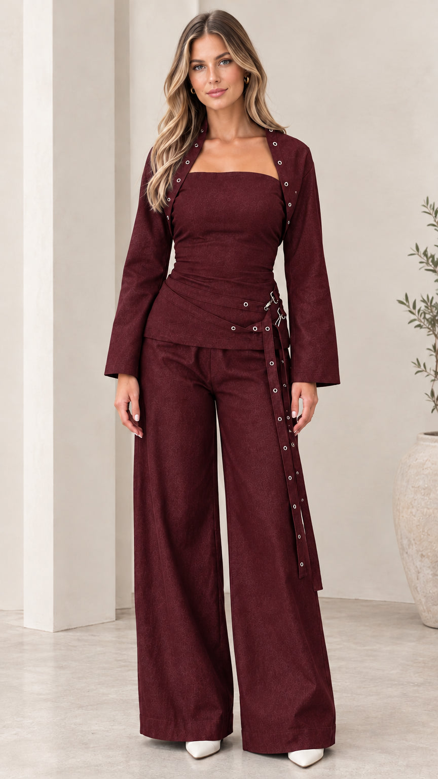 Model wearing Burgundy tailored pants set with open cropped jacket