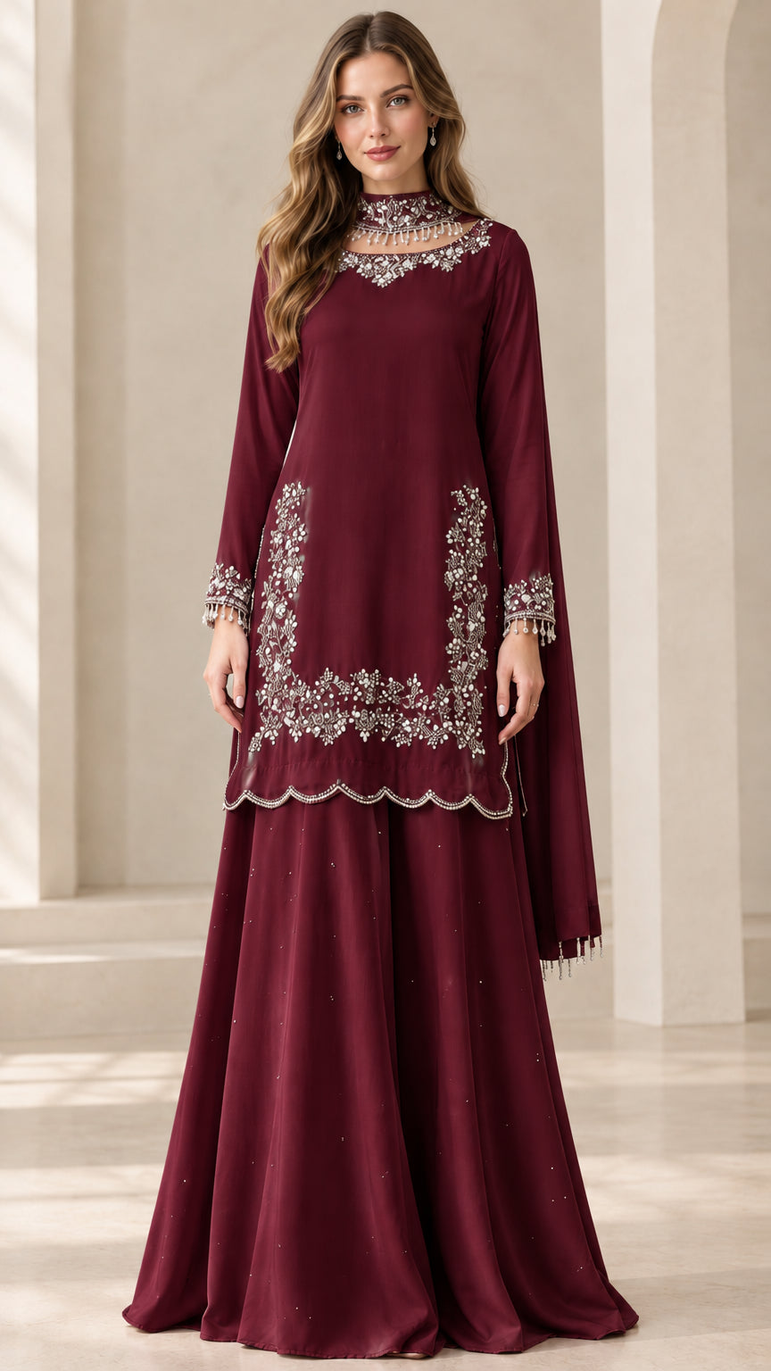 Full-length view of woman wearing Burgundy embroidered sharara suit set