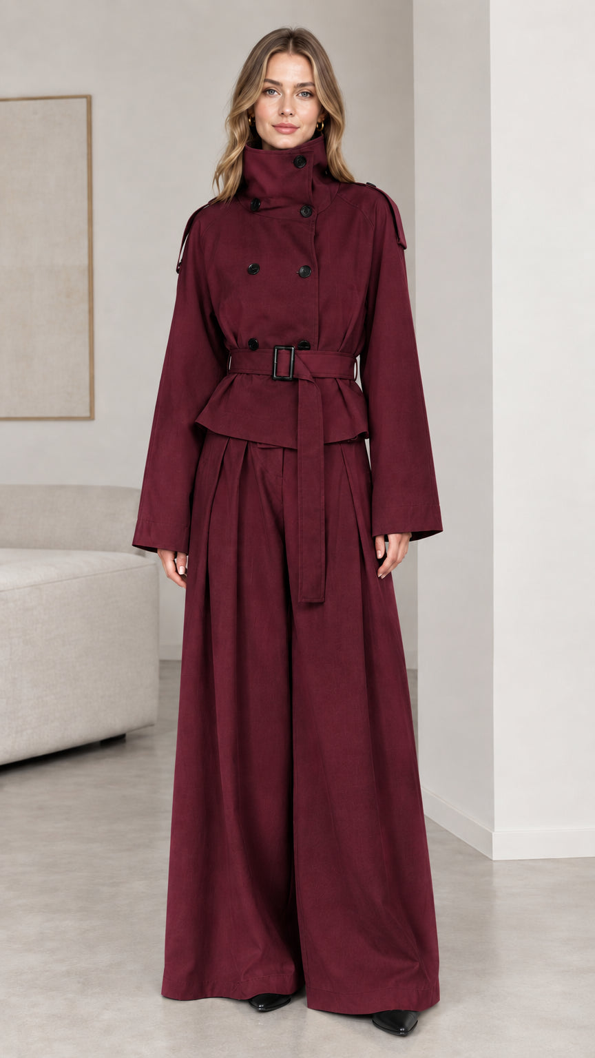 Full-length view of burgundy red belted trench suit and wide-leg trousers set