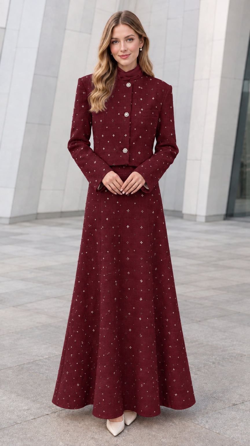 Front view of model wearing Burgundy embellished tweed cropped jacket and maxi skirt set