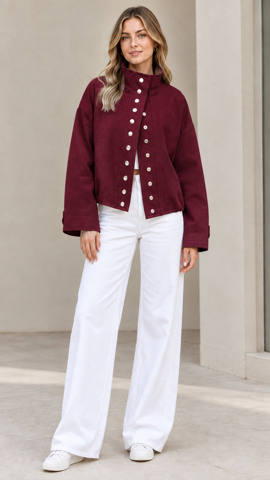 Full-length view of woman wearing Burgundy red stand collar button jacket with white pants