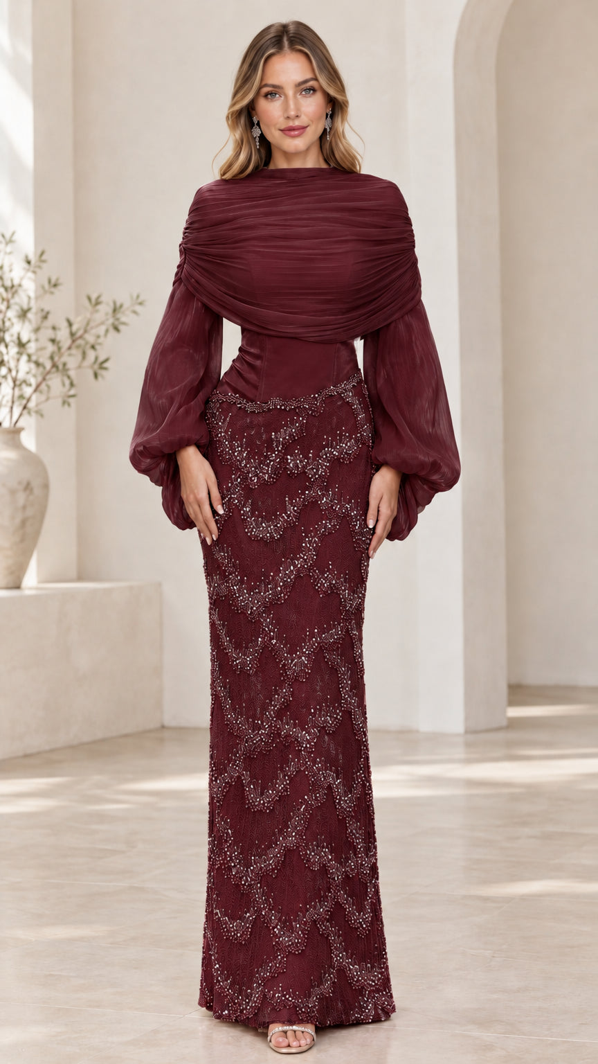 Front view of model wearing burgundy long sleeve beaded evening maxi gown