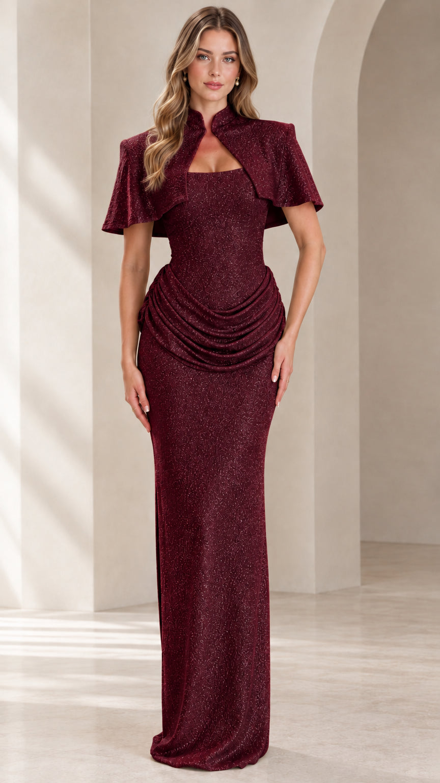 Front view of model wearing Burgundy shimmer capelet evening gown