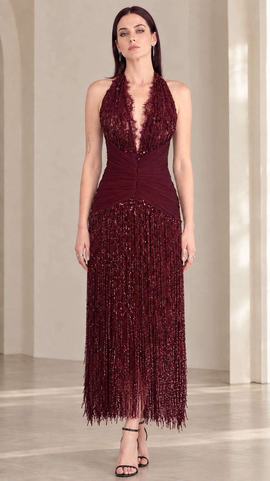 Front view of burgundy wine red halter sequin fringe evening dress