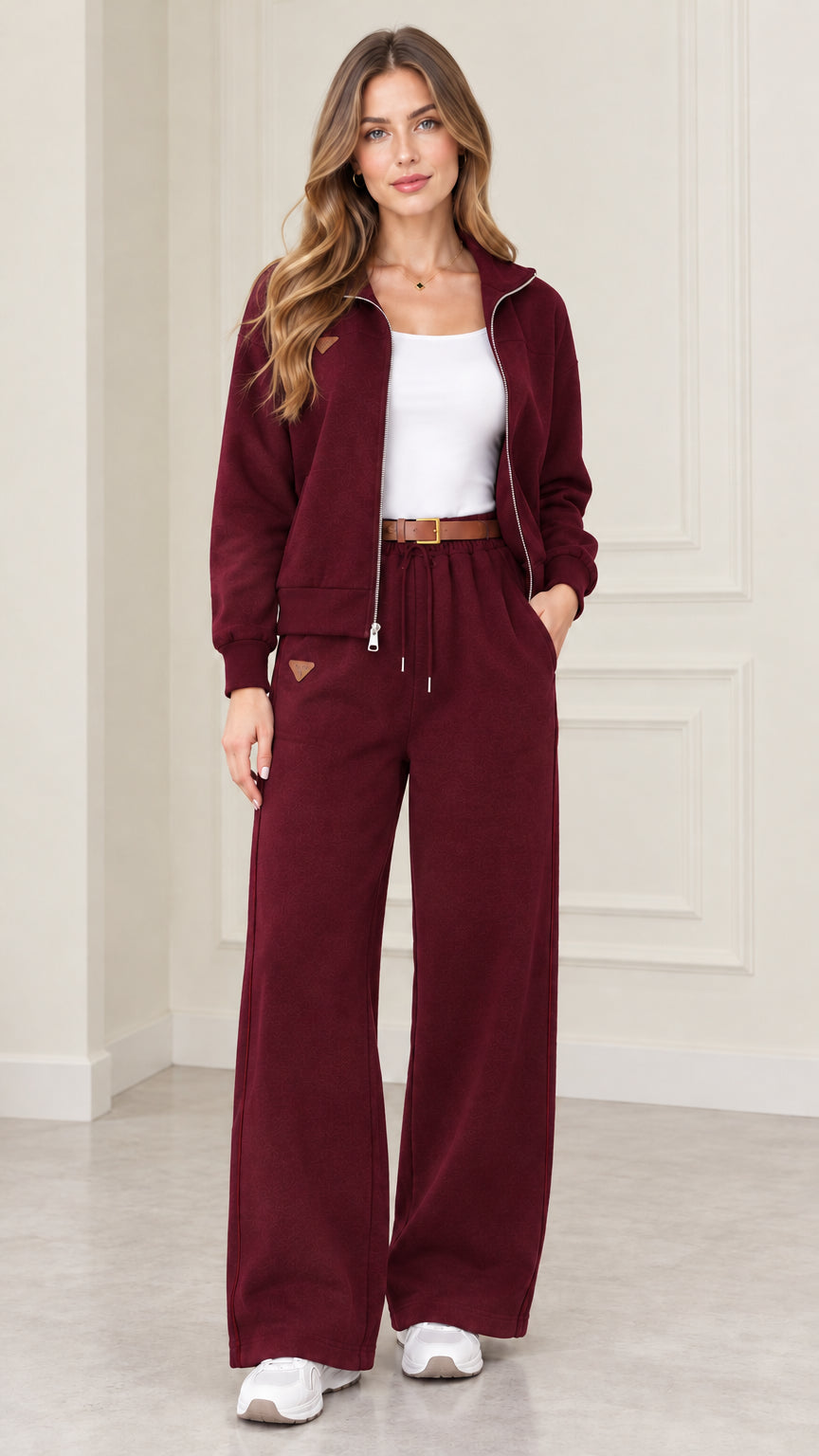 Model wearing Burgundy two-piece zip jacket and wide-leg sweatpants set