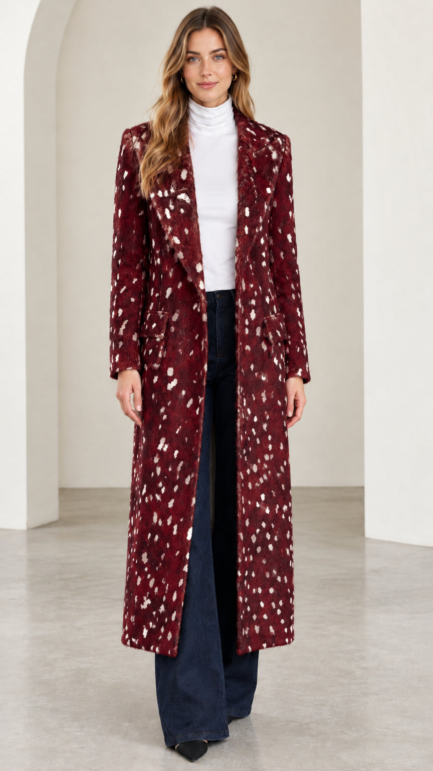 Front view of woman wearing burgundy speckled tailored maxi coat