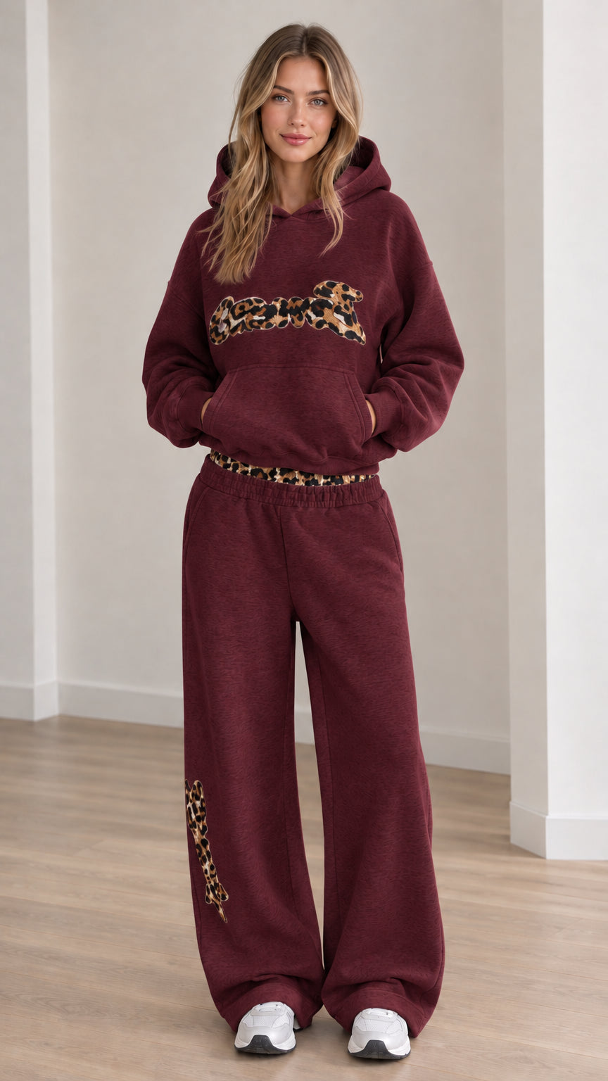 Front view of model wearing the lounge set in Burgundy with wide-leg trousers