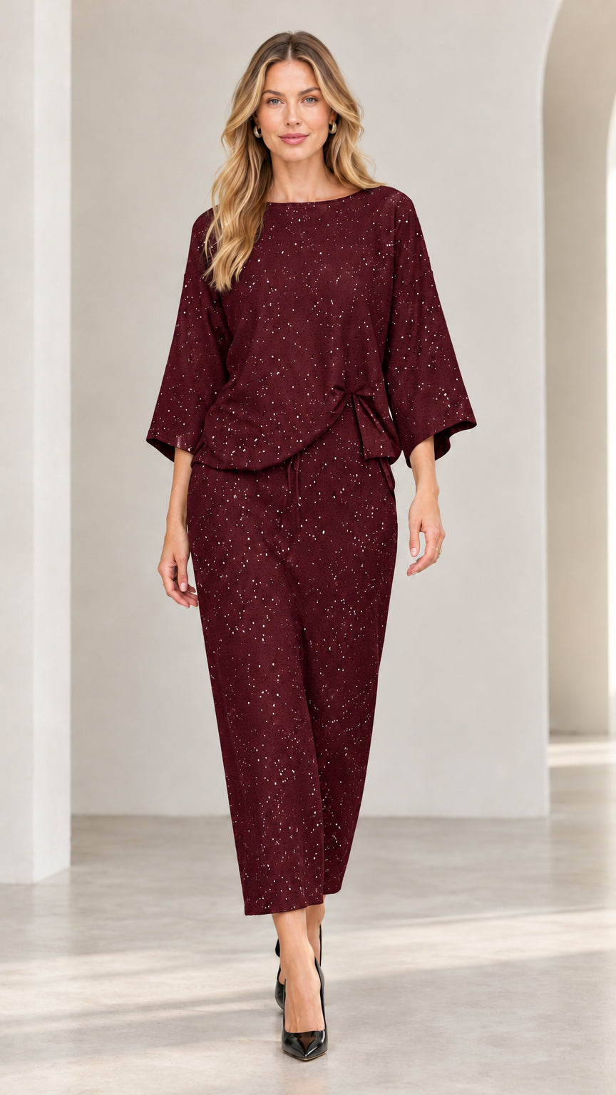 Model wearing burgundy wine red shimmer speckled two-piece pant set