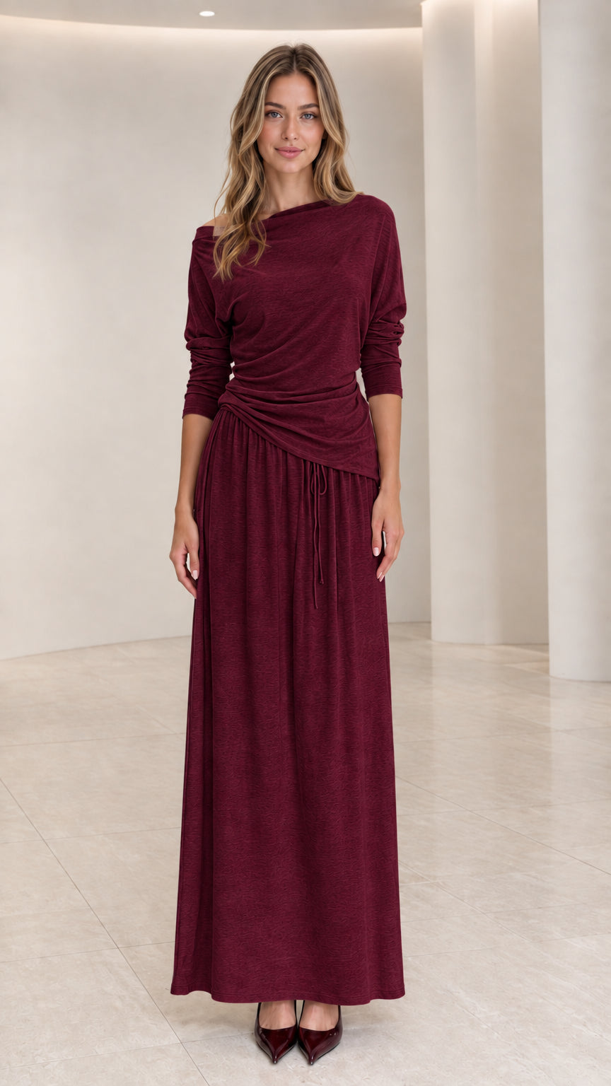 Front view of woman wearing Burgundy long sleeve draped maxi dress