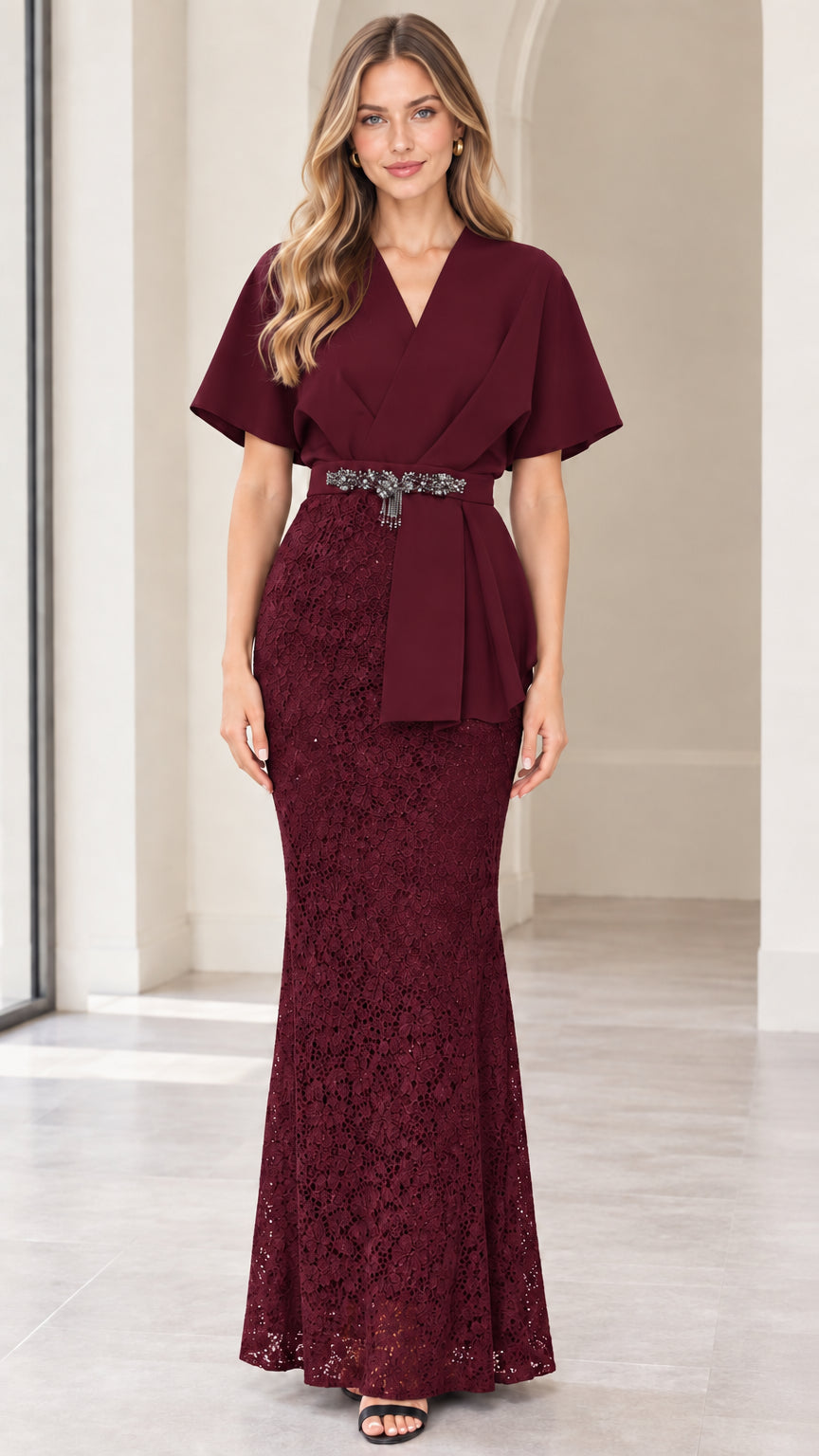 Front full-length view of model wearing burgundy flutter sleeve lace maxi dress