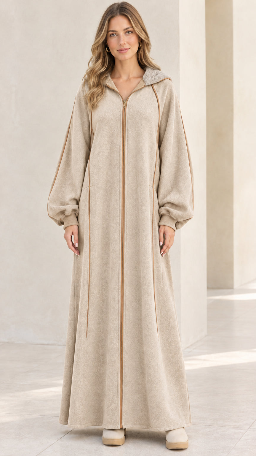 Front view of model wearing beige oatmeal hooded zip-front fleece maxi robe